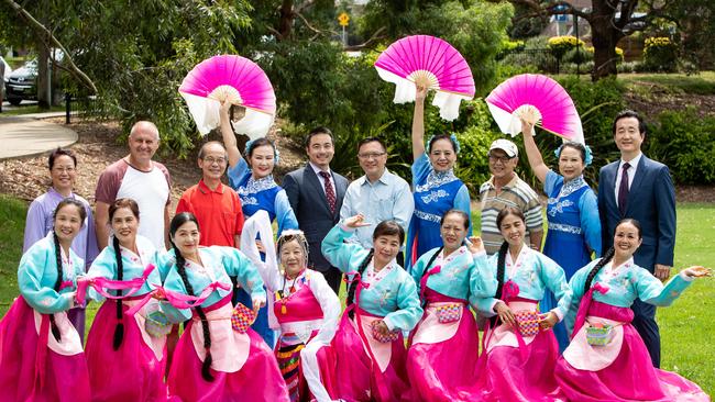 Eastwood Lunar New Year Organising Committee chairman Simon Zhou (fifth from right) with fellow committee members and performers from the Australia Sydney Chinese Folk Dance Group and Eastwood Daichi Incorporated. Picture: Julian Andrews