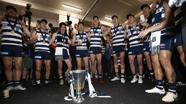 Singing the team song with the premiership cup. Picture: AFL Photos/Getty Images