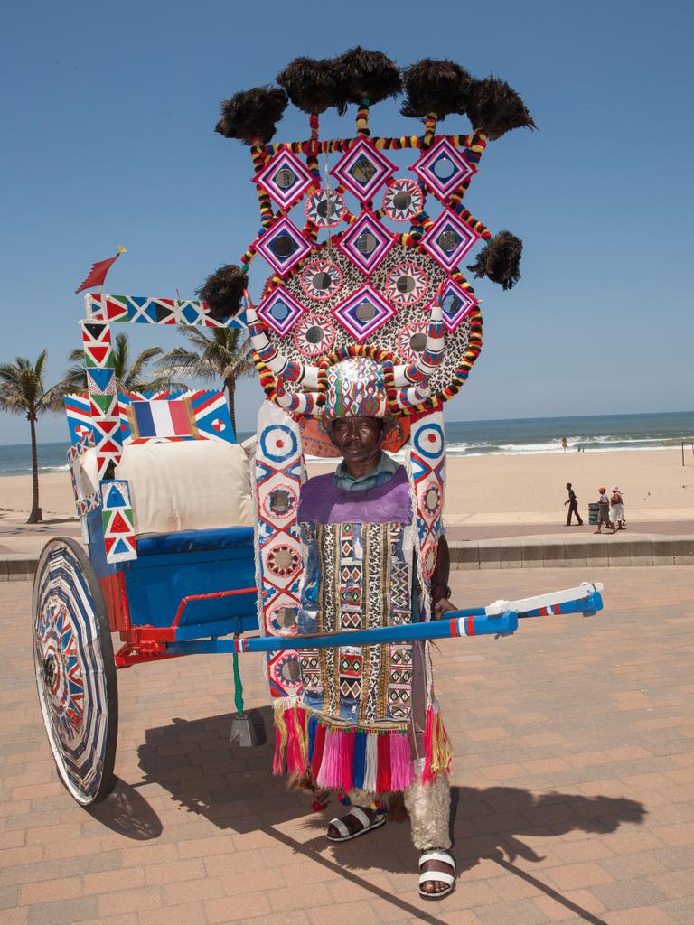 A rickshaw driver at the beach.