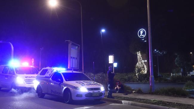 Police found two males (aged 17 and 21) on McGuirk Way who are believed to have been stabbed with glass bottles. Picture: Gordon McComiskie