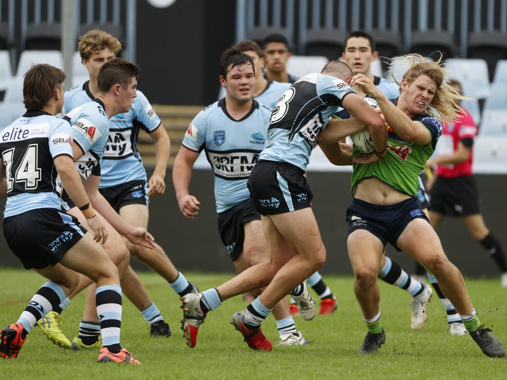 Raiders hooker Jayden Wolfe taken in a strong tackle during the win over the Sharks. Picture: Tim Hunter.