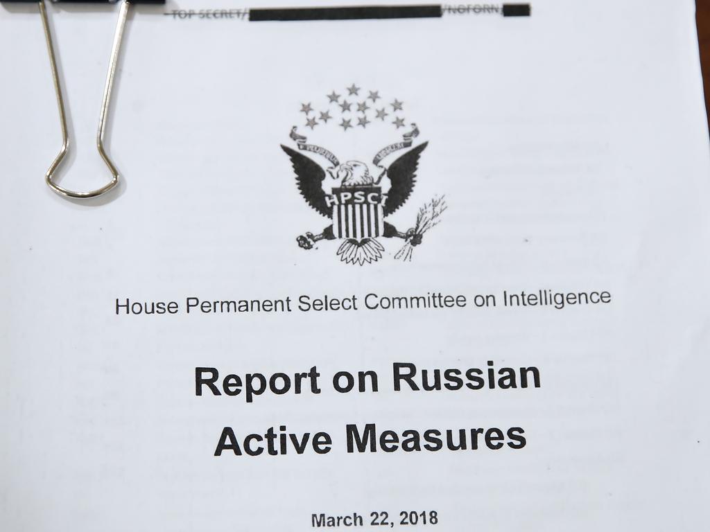 A copy of a report on Russian Active Measures to interfere with US elections is shown during a hearing before theHouse Intelligence Committee, as the US grapples with how to stem Russian interference in another election. Picture: Drew Angerer/Getty Images/AFP