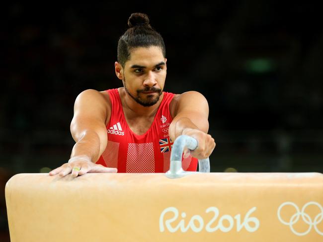 RIO DE JANEIRO, BRAZIL - AUGUST 08: Louis Smith of Great Britain shows his dejection after falling while competing on the pommel horse during the men's team final on Day 3 of the Rio 2016 Olympic Games at the Rio Olympic Arena on August 8, 2016 in Rio de Janeiro, Brazil. (Photo by Alex Livesey/Getty Images)