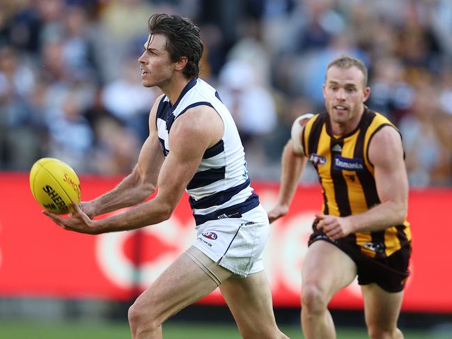 Isaac Smith looks to get the handball away. Picture: Michael Klein