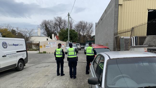 Police on the scene of a planned operation at Moonah. Police are conducting several raids around Greater Hobart. Picture: JAMES KITTO