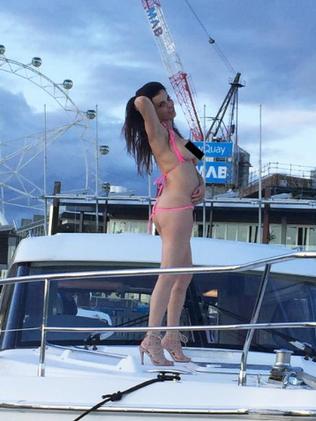 Suzi Taylor was photographed dancing topless on a boat in Melbourne.