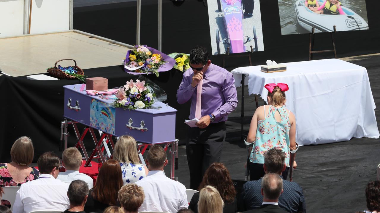 Anita's father Ian (purple shirt) and her sister Zara speak at the funeral. Picture: Colin Murty/The Australian