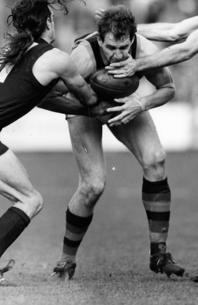 Mark Mickan holds on to the footy against Carlton at Princes Park in 1992.