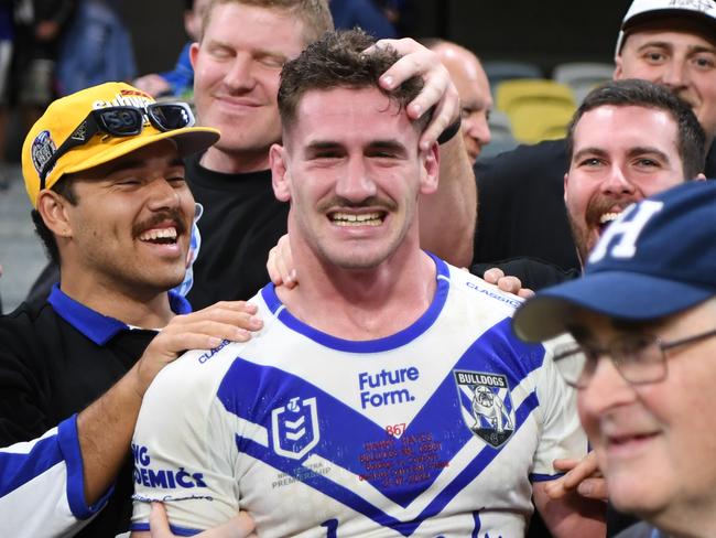 Harry Hayes celebrates his NRL debut with friends and family.