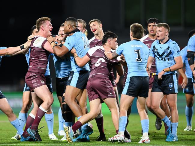 NSW and Queensland players come together.