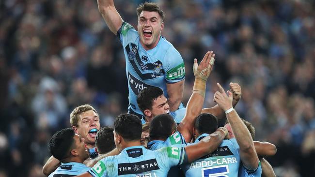 Players celebrate after the NSW Blues defeated Queensland Maroons in Game 2 of State of Series at ANZ Stadium, Sydney. Picture. Phil Hillyard