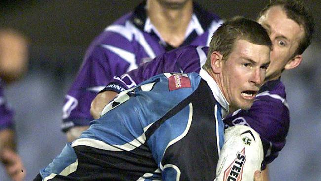 Adam Dykes runs the ball against the Melbourne Storm in 2001. Picture: Mark/Evans.