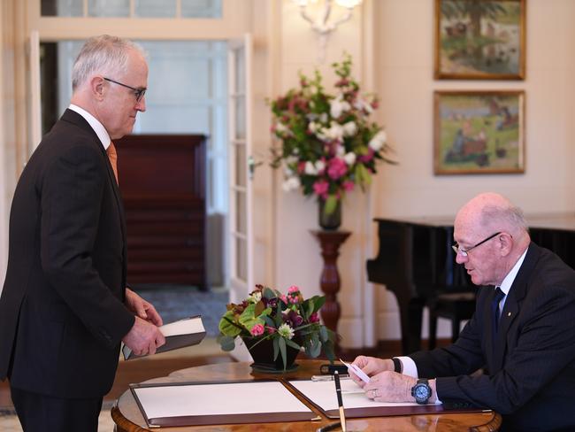 Australian Prime Minister Malcolm Turnbull (left) is sworn in as Agriculture Minister by Governor-General Sir Peter Cosgrove at Government House in Canberra, Friday, October 27, 2017. Today the Australian High Court handed down its decision on the legality of the election of seven MPs with dual citizenship, including Australian Deputy Prime Minister Barnaby Joyce. (AAP Image/Lukas Coch) NO ARCHIVING