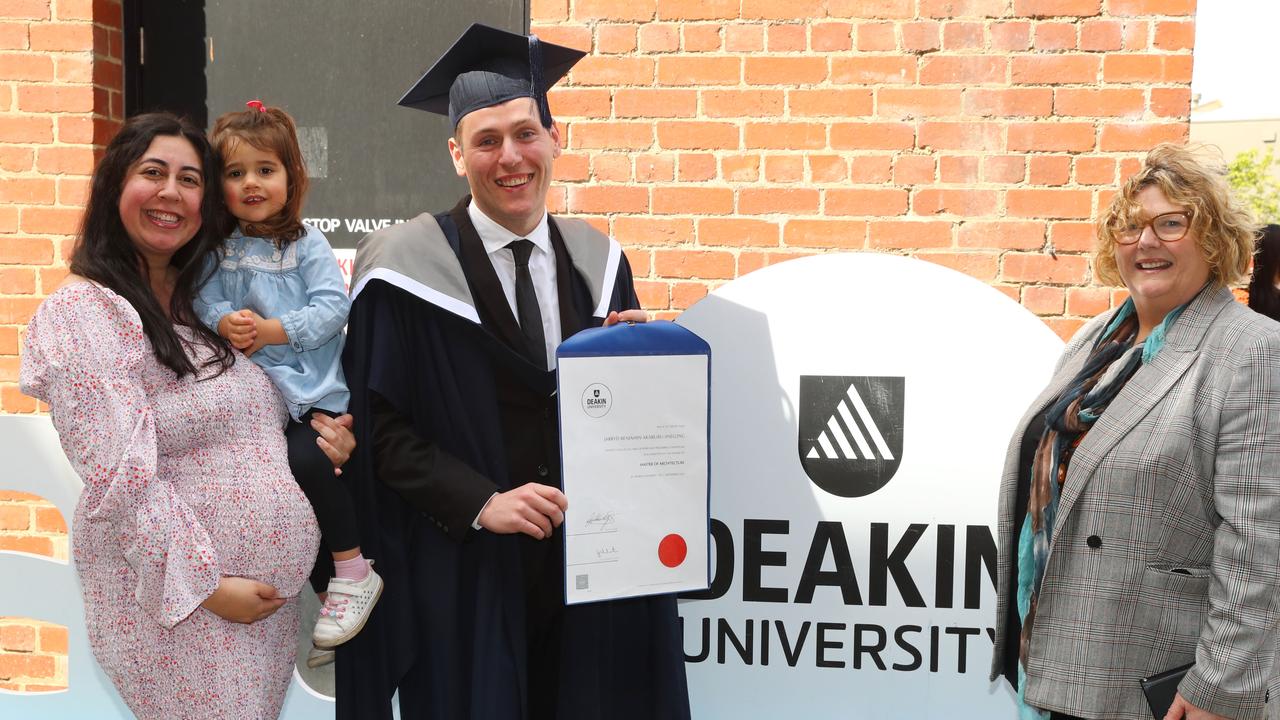 Deakin University graduate Jarryd Akaaruru-Snelling with wife Jessica and daughter Marley, 2. Mum Debra. Picture: Alison Wynd