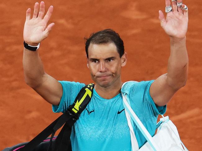 TOPSHOT - Spain's Rafael Nadal gestures to the public as he leaves the court after losing against Germany's Alexander Zverev in their men's singles match on Court Philippe-Chatrier on day two of The French Open tennis tournament at The Roland Garros Complex in Paris on May 27, 2024. (Photo by Alain JOCARD / AFP)