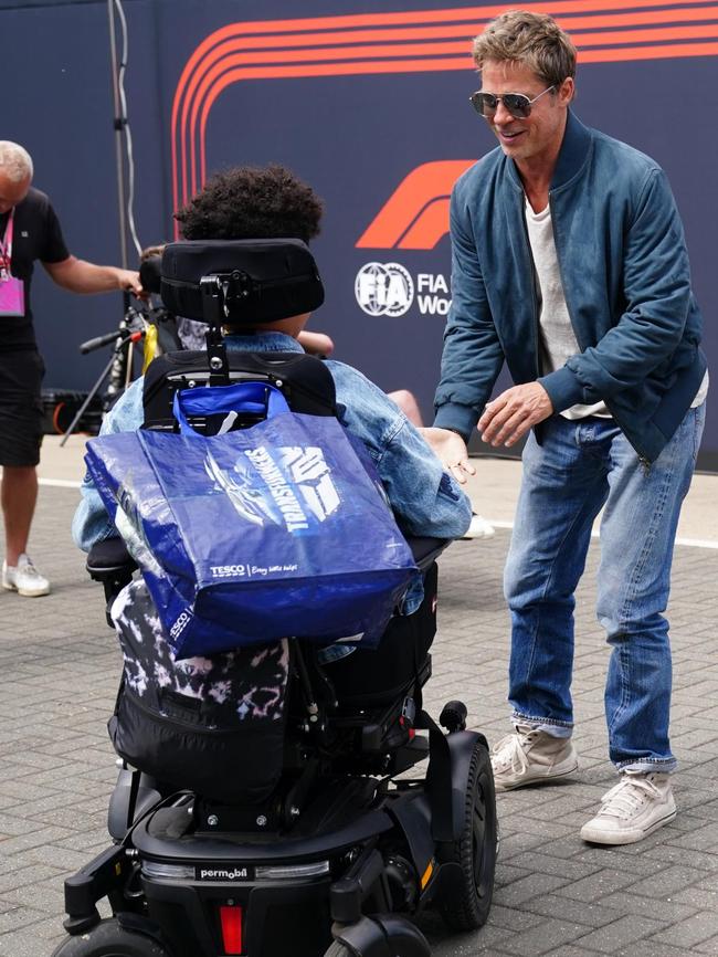 Pitt talks to a fan in between takes at Silverstone. Picture: David Davies/PA