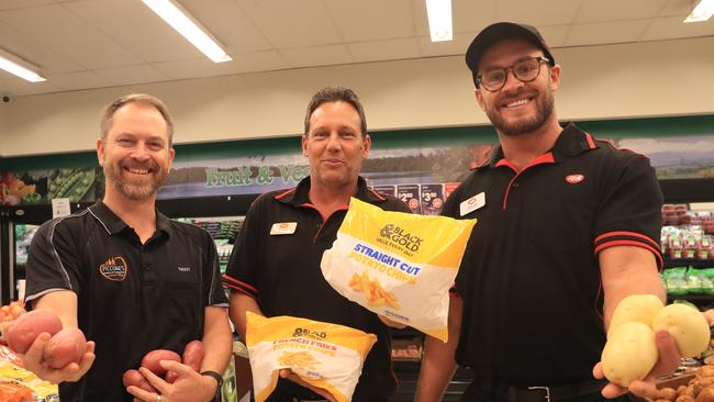 Piccones IGA general manager Trent Haddow, Edmonton IGA store manager Heath Randall and IGA produce manager Taylor Bartley-Rayner holding up would-be wedges. Picture: Sandhya Ram