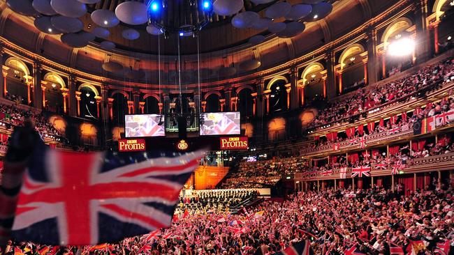 People wave flags at the Royal Albert Hall in west London on the last night of the Proms in 2013, waving the Union Jack, singing "Rule Britannia!". Picture: AFP