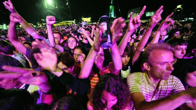 Young people enjoying a concert of Serbian band Partibrejkers during the Belgrade Beer Fest.