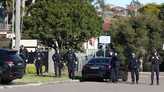 Police officers sweep Bertha Street, Merrylands today. Picture: John Grainger