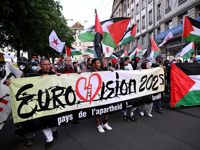 Protesters and activists from BDS hold a banner reading 