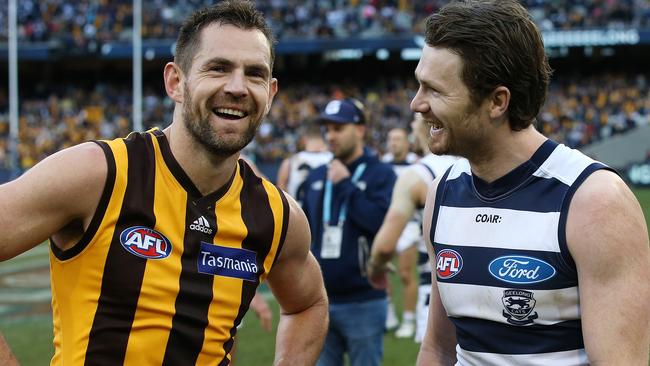 Mates Luke Hodge and Patrick Dangerfield have a laugh following the Cats narrow win over the Hawks. Picture: Michael Klein