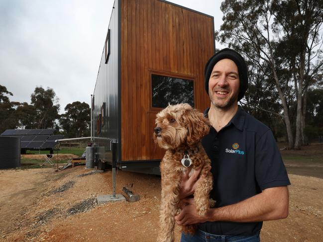 Luke Shavak, a man who lives with his wife and 2 daughters completely off-grid in a Ã¢â¬ÅTiny House" in Castlemaine. Luke with his dog Daisy outside the Tiny House.                      Picture: David Caird