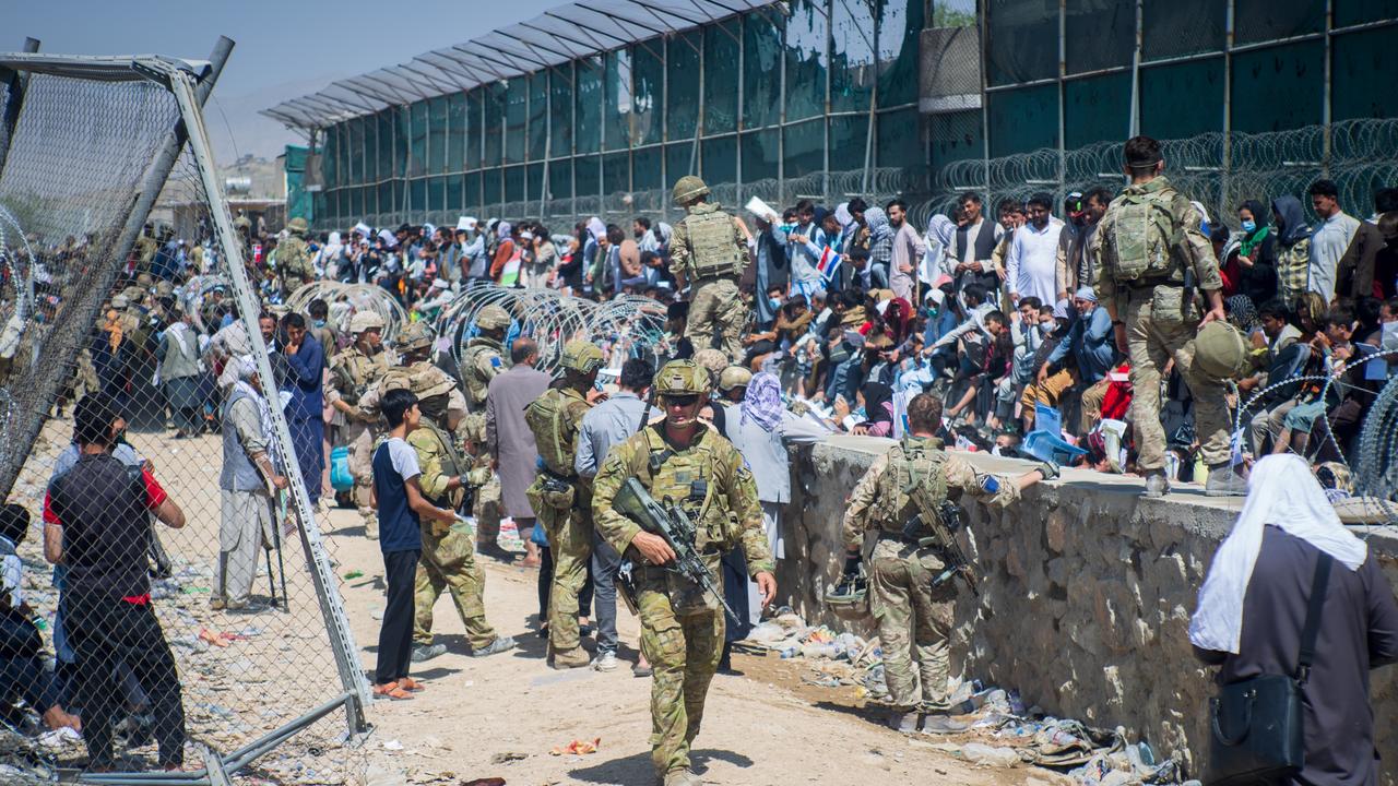 Australian soldiers helping to locate Afghan Australian visa holders attempting to enter the congested Abbey Gate at Hamid Karzai International Airport prior to Thursday’s explosion.