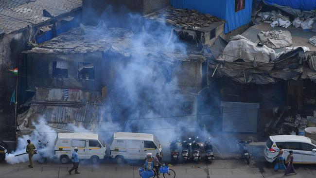 Fumigation inside the Dharavi slum in Mumbai on Monday as the government enforces a nationwide lockdown. Picture: AFP