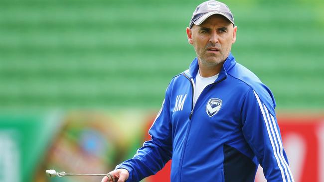 Coach Kevin Muscat looks over to the media during Melbourne Victory’s training session at AAMI Park on Tuesday. Picture: Getty Images