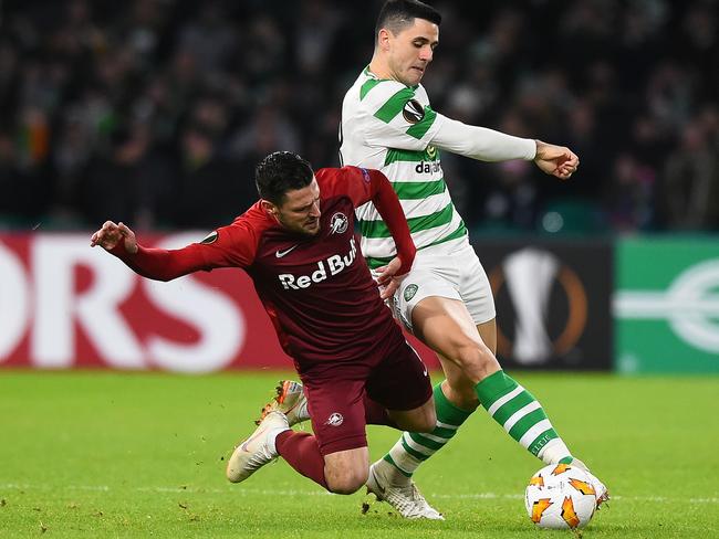 Tom Rogic (right) in action for Celtic.