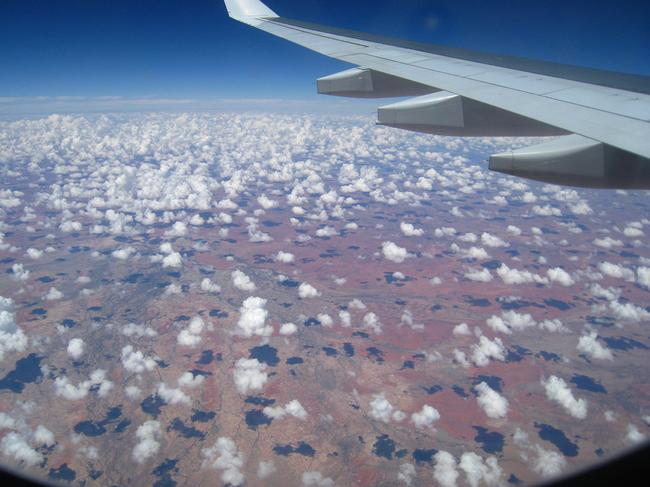 Plane windows: "In the Clouds: View through the window of the Qantas Airbus A330 plane while flying over the Australian Outback on the way to Mumbai, India" Picture: Francisco Martins via Flickr http://www.flickr.com/photos/betta_design/2276988258/