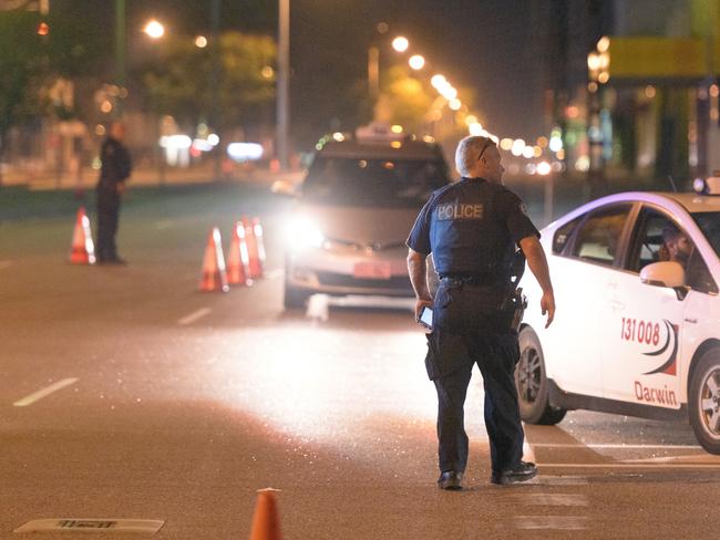 Police cordon off the intersection of Stuart Highway and McMinn Street where the alleged gunman was apprehended in Darwin. Picture: AAP