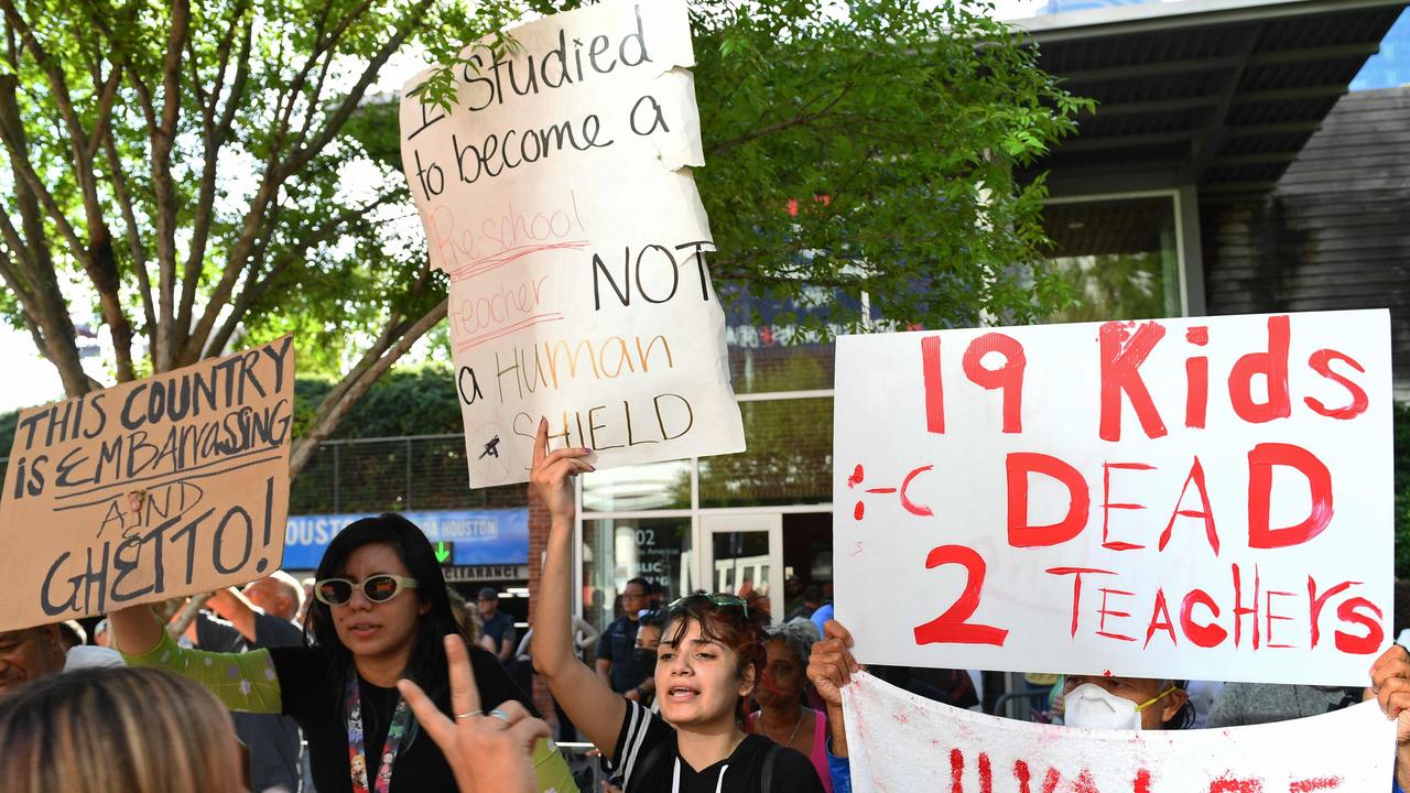 Protesters in support of gun control hold signs outside the National Rifle Association Annual Meeting. Picture: Patrick T.Fallon/AFP