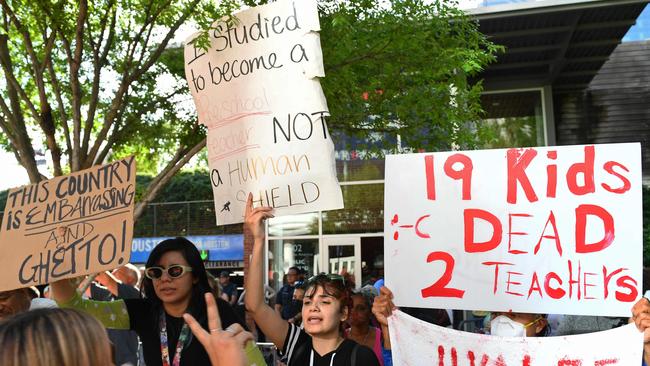 Protesters in support of gun control hold signs outside the National Rifle Association Annual Meeting. Picture: Patrick T.Fallon/AFP