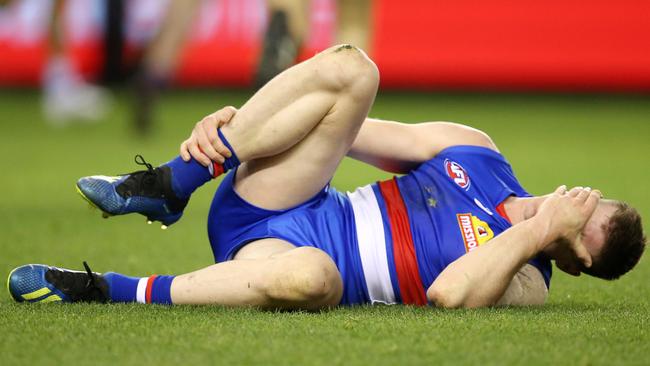 Billy Gowers grabs his ankle after failing awkwardly. Picture: Michael Klein