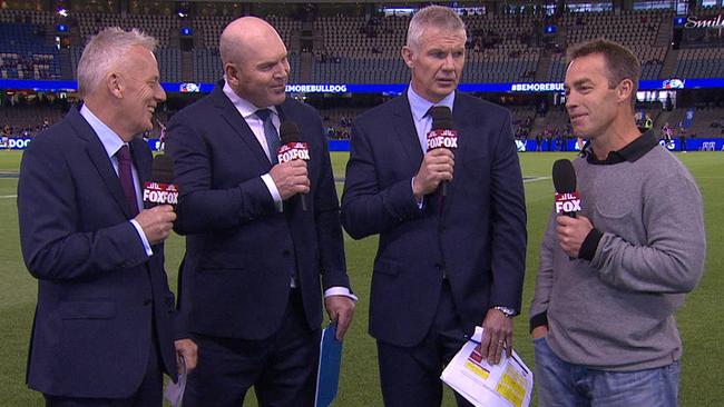 Alistair Clarkson (far right) explains his altercation with a Port Adelaide fan on Fox Footy.