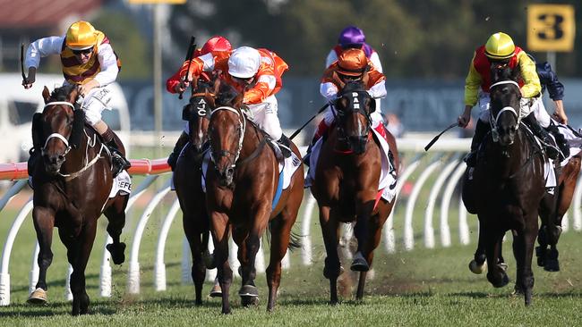 Jockey Hugh Bowman on Preferment (left) leads to win The BMW race during the Western Sydney Legends Day at Rosehill race course in Sydney, Saturday, March 26, 2016. (AAP Image/David Moir) NO ARCHIVING, EDITORIAL USE ONLY