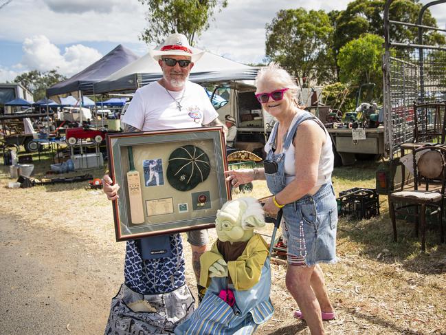 Cameron and Debbie Barnes of Hillcrest picked up framed Don Bradman memorabilia and a 1m tall Yoda at the Toowoomba Swap hosted by Darling Downs Veteran and Vintage Motor Club at Toowoomba Showgrounds, Saturday, February 1, 2025. Picture: Kevin Farmer