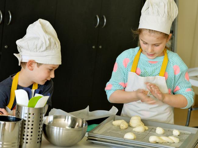 Miles, 5 and Sophie, 10, cook up a storm. Picture: Kris Reichl