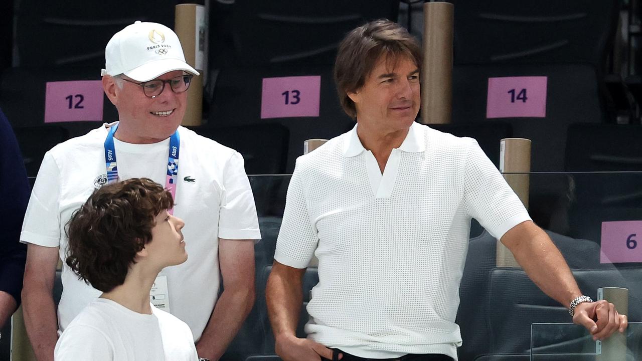 Tom Cruise cheers on Simone Biles with David Zaslav. Picture: Getty Images