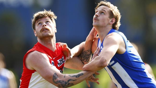 Swans ruckman Peter Ladhams, pictured jostling with young Kangaroos big man Jacob Edwards in the VFL, hopes to break into the senior side in time for finals. Picture: Getty Images