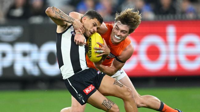 Bobby Hill tries to get out of a Cameron Fleeton tackle. Picture: Quinn Rooney/Getty Images