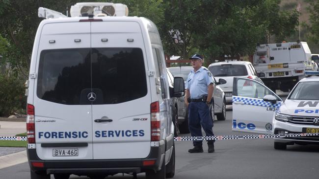 Police have set up a crime scene after the stabbing death of a 10 year old girl. Photo Jeremy Piper