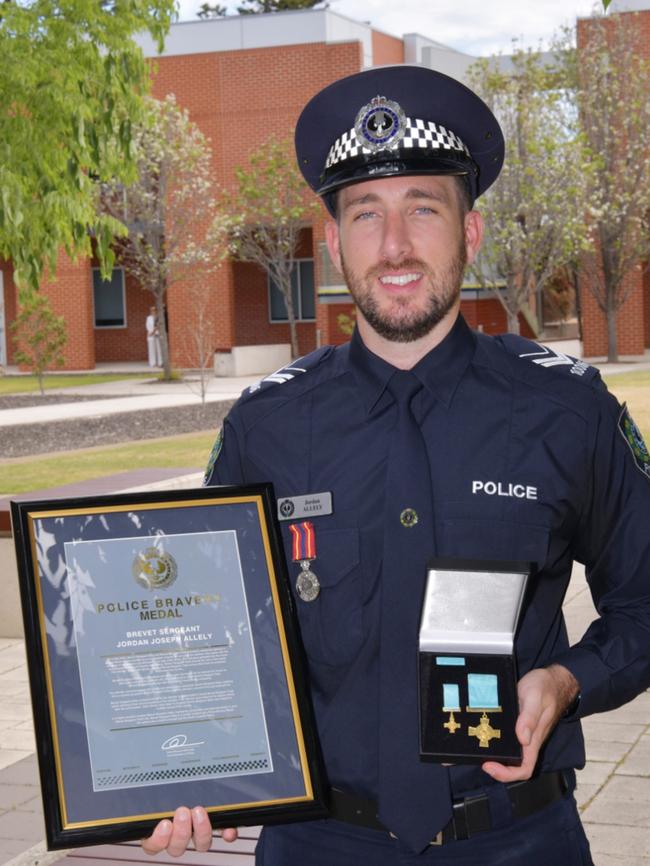 South Australian Police Brevet Sergeant Jordan Allely with his bravery award on Wednesday 16 October. Picture: Supplied