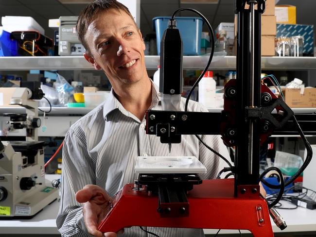 27/02/18 Medical scientist Chris Drogemuller at the Adelaide University Health & Medical Sciences building in the city with a 3D printer he is using for medical research. picture CALUM ROBERTSON