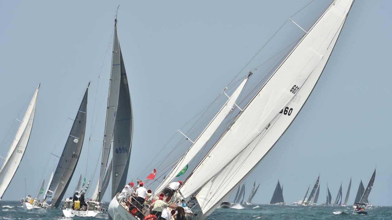 (FILES) In this file photo taken on December 26, 2019 yachts sail out of Sydney harbour at the start of the Sydney to Hobart yacht race. - Australia's gruelling Sydney to Hobart yacht race was called off for the first time in 76 years on December 19, 2020, amid an escalating outbreak of coronavirus, organisers said. (Photo by PETER PARKS / AFP) / -- IMAGE RESTRICTED TO EDITORIAL USE - STRICTLY NO COMMERCIAL USE --