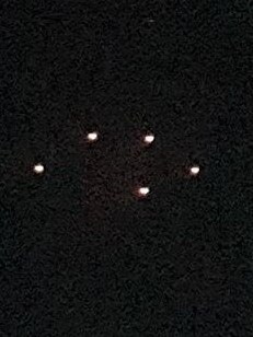 A mysterious formation of lights spotted hovering over Humpty Doo. Picture: Supplied