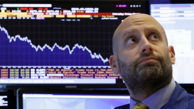 Specialist Meric Greenbaum works at his post on the floor of the NYSE. Picture: Richard Drew/AP