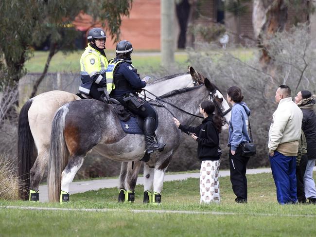 Police patrol the area the morning after the shooting. Picture: Andrew Henshaw